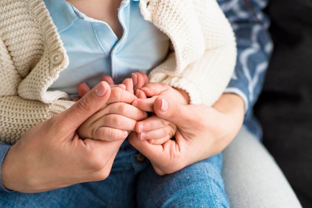 mother holding cerebral palsy baby